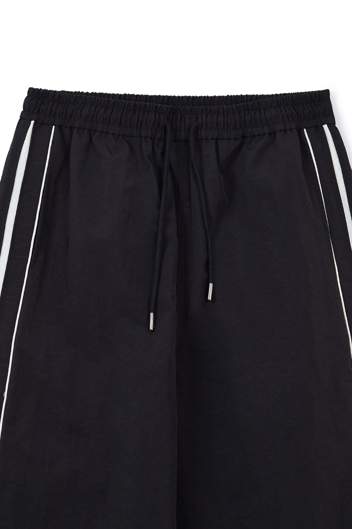 Matin Kim Side Logo Wide Track Pants — Black
