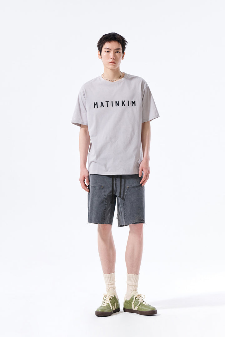 Matin Kim Herringbone Raw Cut Denim Shorts — Gray