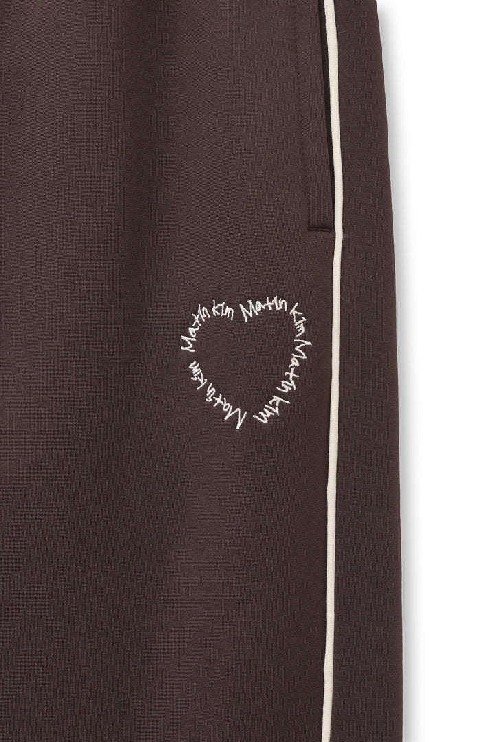 Matin Kim Heart Logo Track Pants — Brown