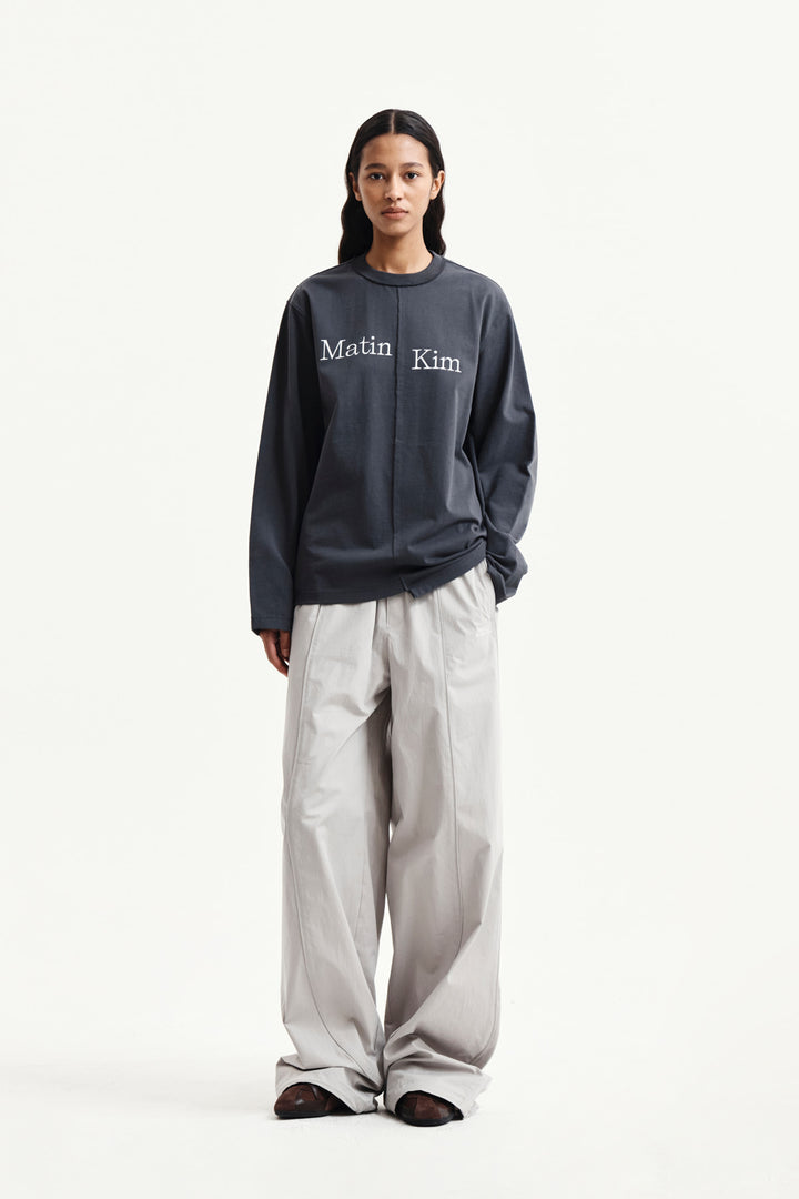 Matin Kim Asymmetric Logo Top — Charcoal