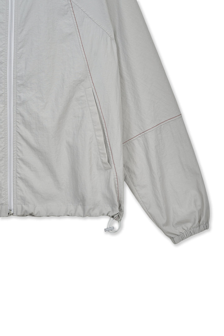 Matin Kim Back Logo Windbreaker — Light — Beige