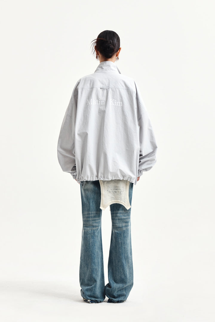 Matin Kim Back Logo High Neck Jumper — Light Grey