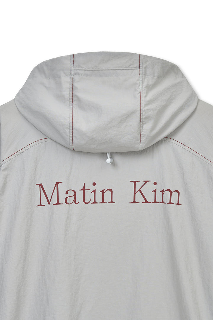 Matin Kim Back Logo Windbreaker — Light — Beige