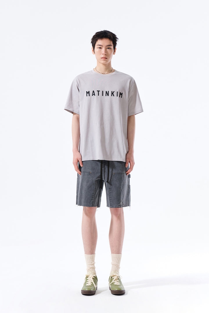 Matin Kim Herringbone Raw Cut Denim Shorts — Gray