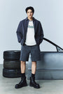 Matin Kim Herringbone Raw Cut Denim Shorts — Gray