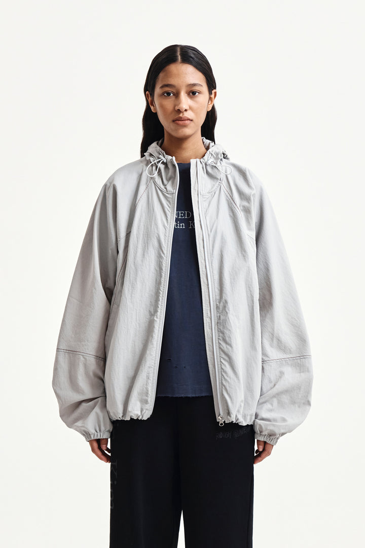 Matin Kim Back Logo Windbreaker — Light — Beige