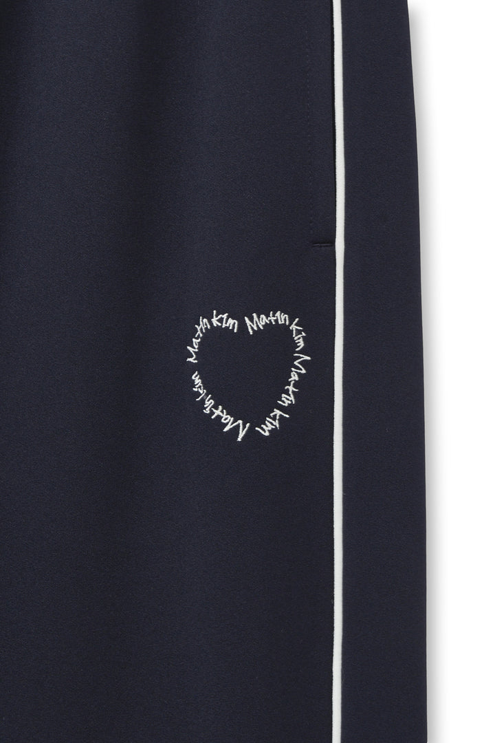 Matin Kim Heart Logo Track Pants — Navy blue