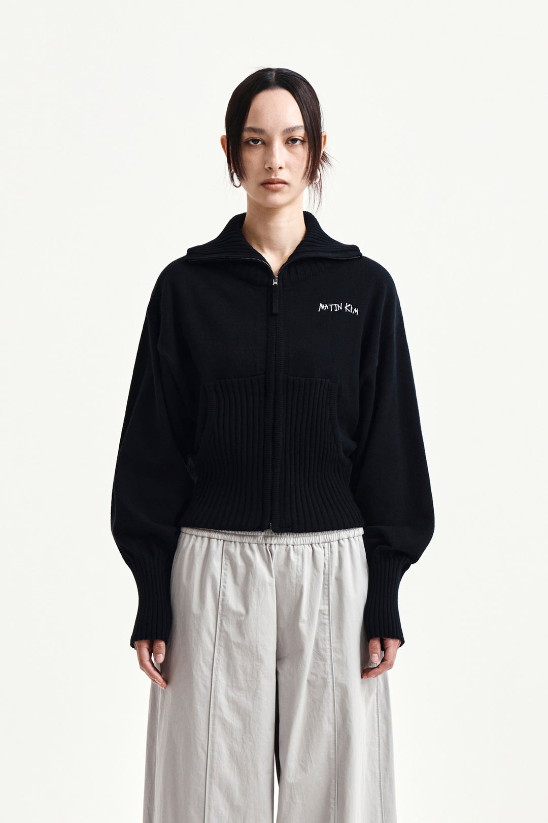 Matin Kim High Neck Embroidered Logo Zip Up — Black