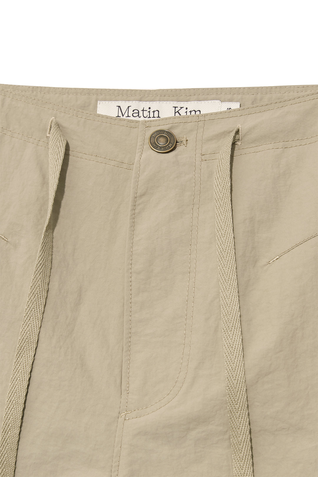 Matin Kim Nylon String Half Pants — Beige