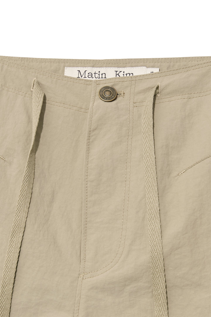 Matin Kim Nylon String Half Pants — Beige
