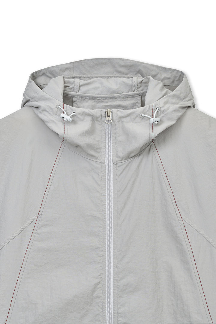 Matin Kim Back Logo Windbreaker — Light — Beige