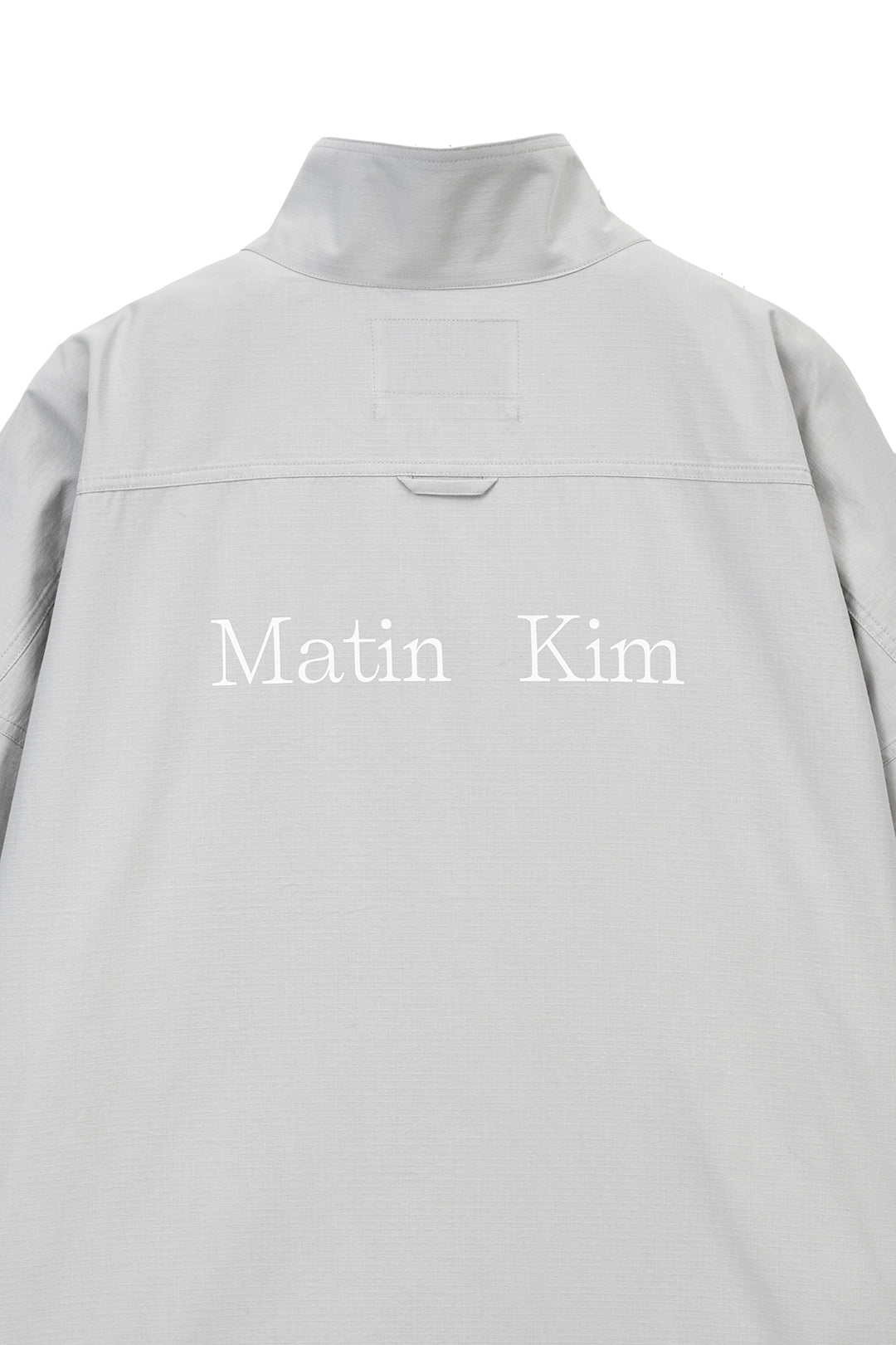 Matin Kim Back Logo High Neck Jumper — Light Grey
