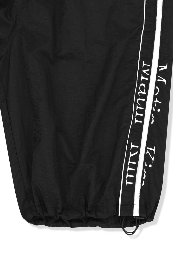 Matin Kim Side Logo Bermuda Track Pants — Black
