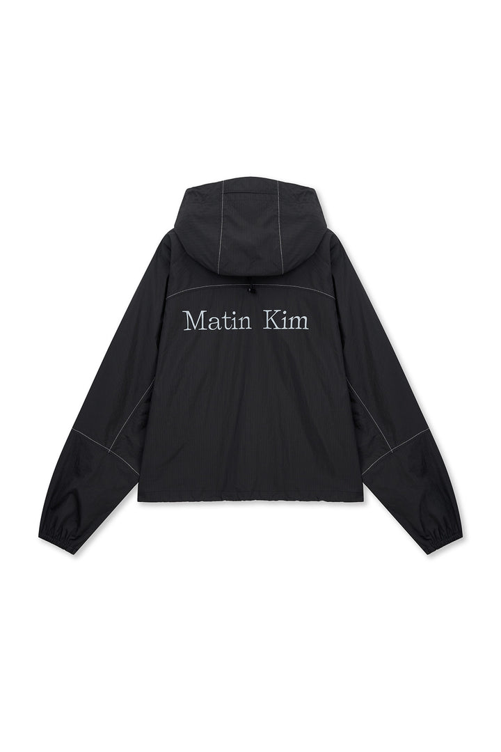 Matin Kim Cropped Back Logo Windbreaker — Black