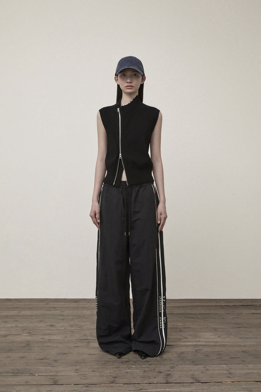 Matin Kim High Neck Logo Knit Zip Vest — Black