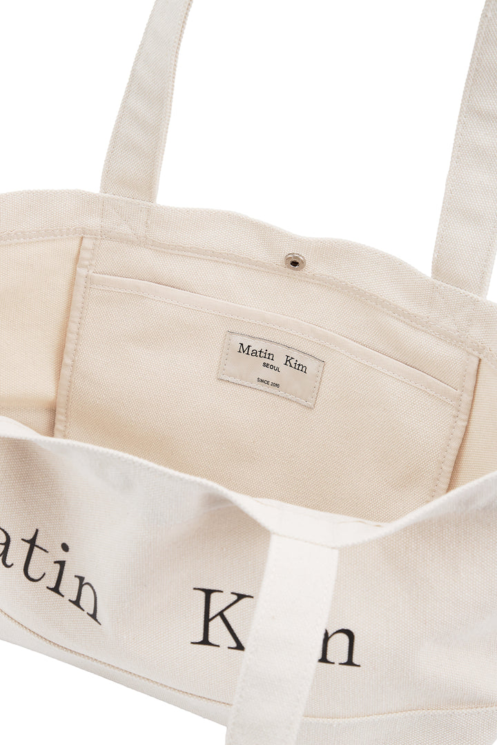 Matin Kim Logo Canvas Wide Shoulder Bag — Ivory