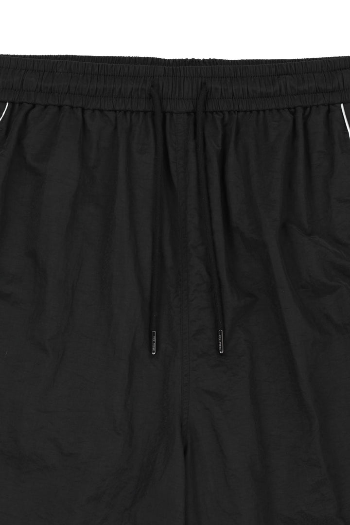 Matin Kim Side Logo Bermuda Track Pants — Black