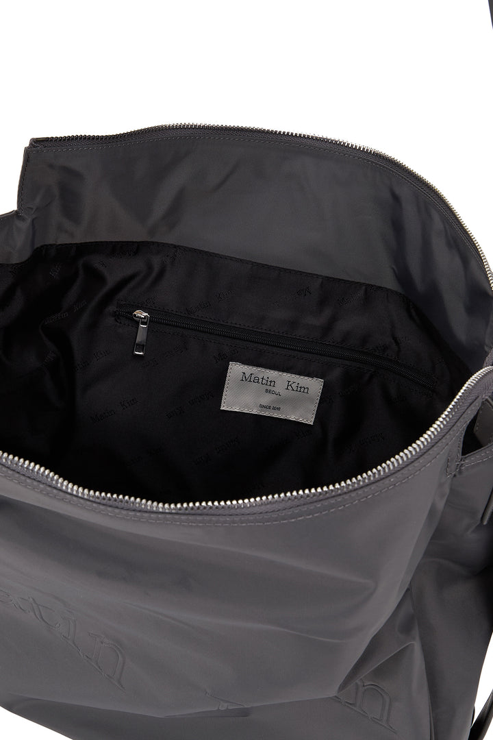 Matin Kim Embossed Logo Nylon Shoulder Bag — Charcoal