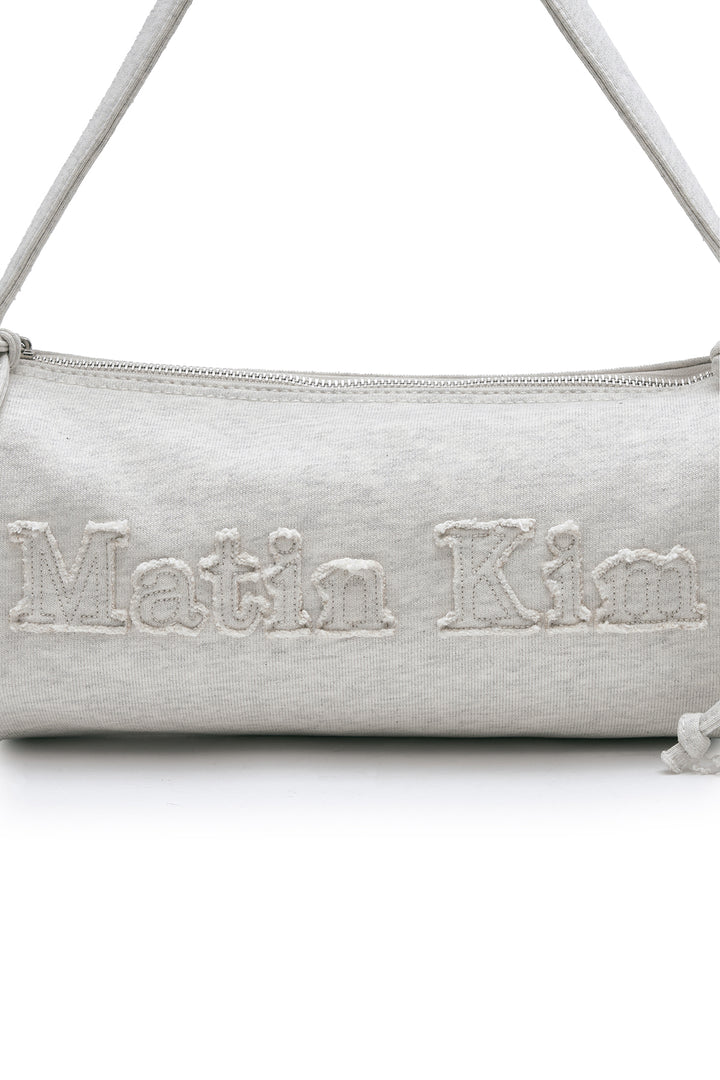 Matin Kim Appliqué Logo Jersey Duffle Bag — Beige
