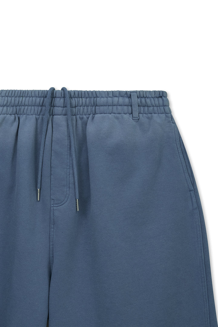 Matin Kim Vintage Washed Back Logo Bermuda Sweatpants — Blue