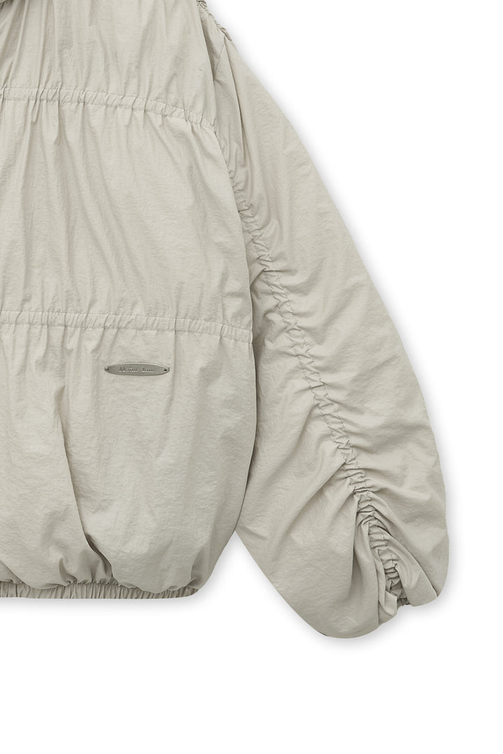 Matin Kim High Neck Shirring Down Jumper — Beige