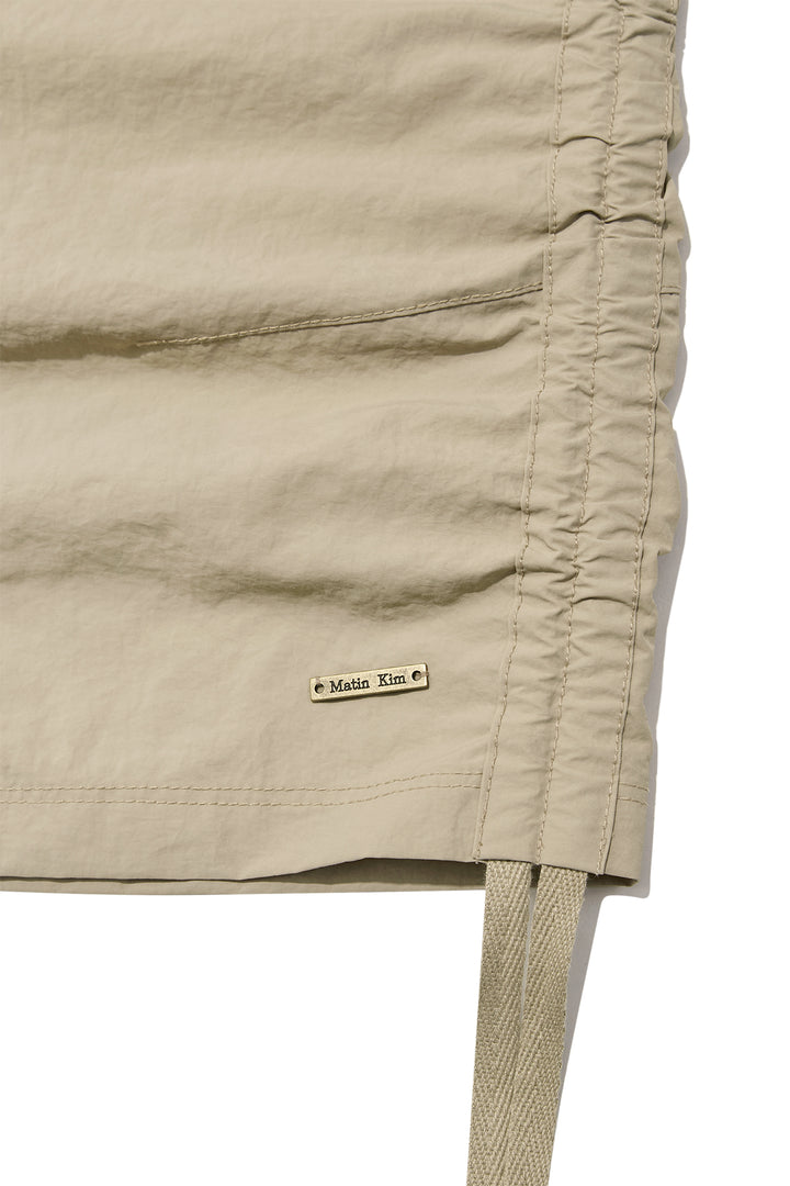 Matin Kim Nylon String Half Pants — Beige