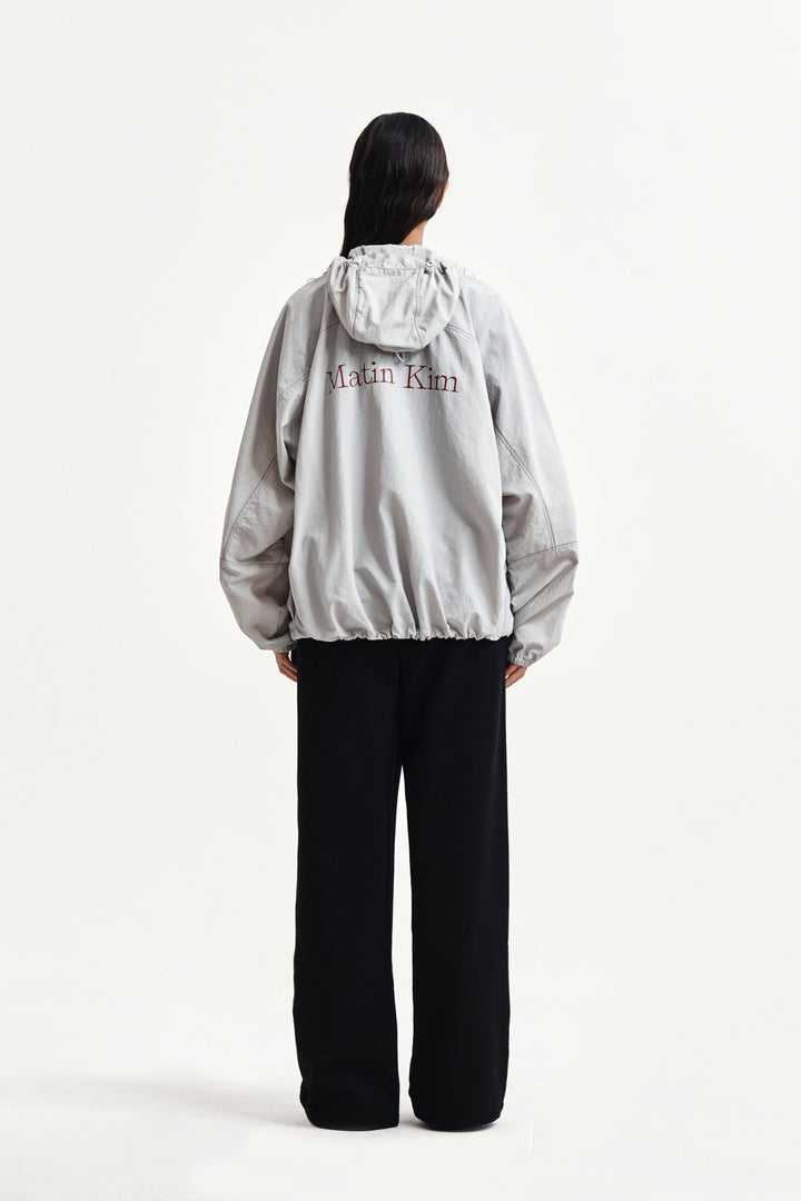 Matin Kim Back Logo Windbreaker — Light — Beige
