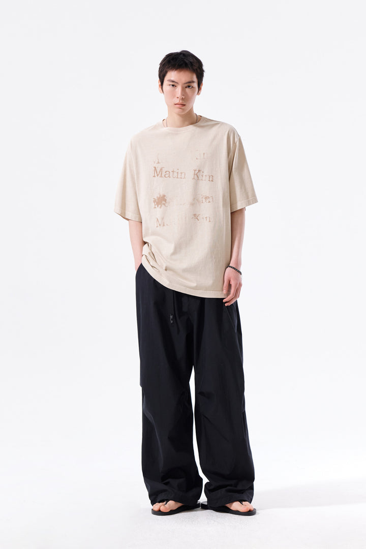Matin Kim Pigment Graffiti Logo Tee — Beige