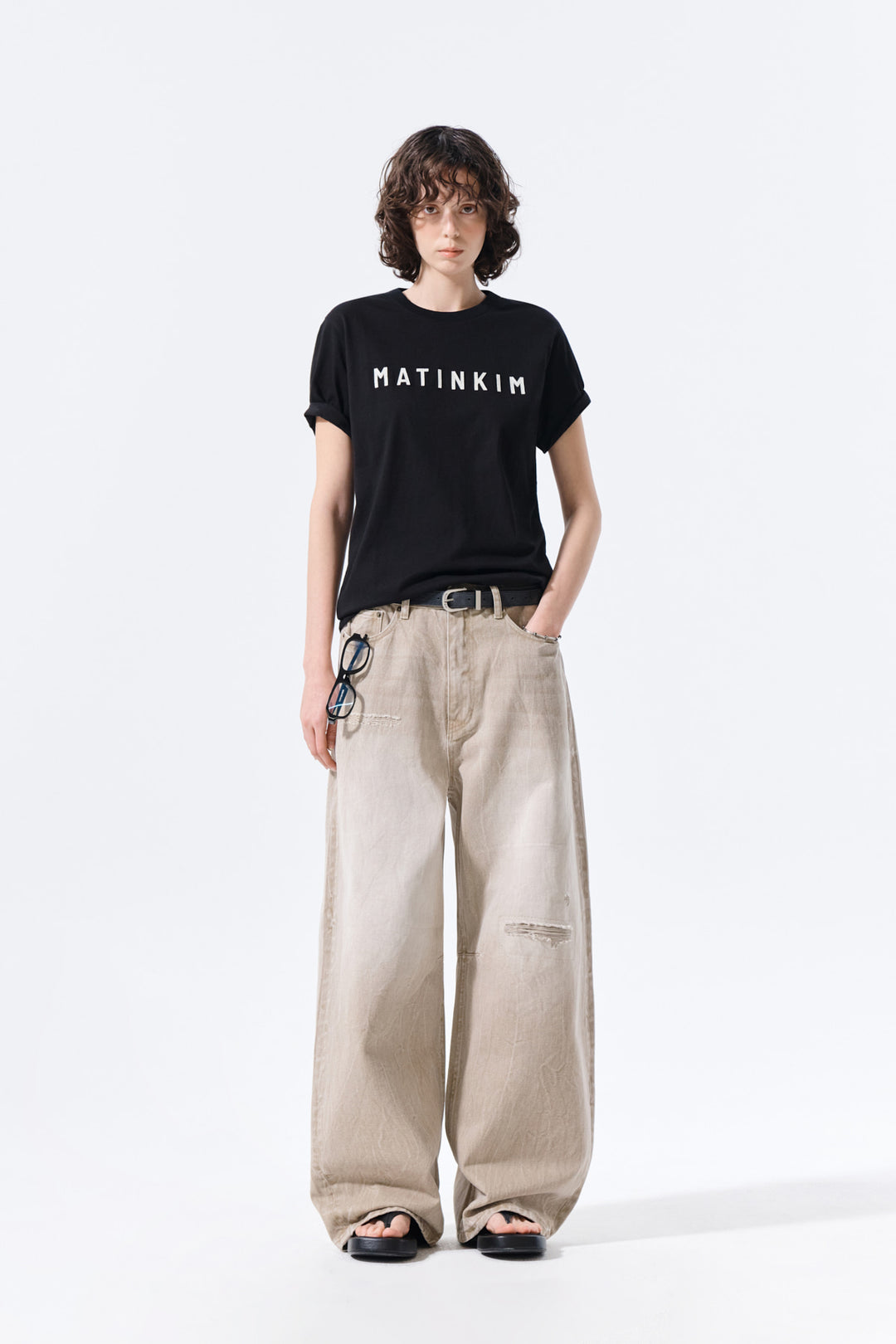 Matin Kim Back Logo Washed Denim Pants — Beige