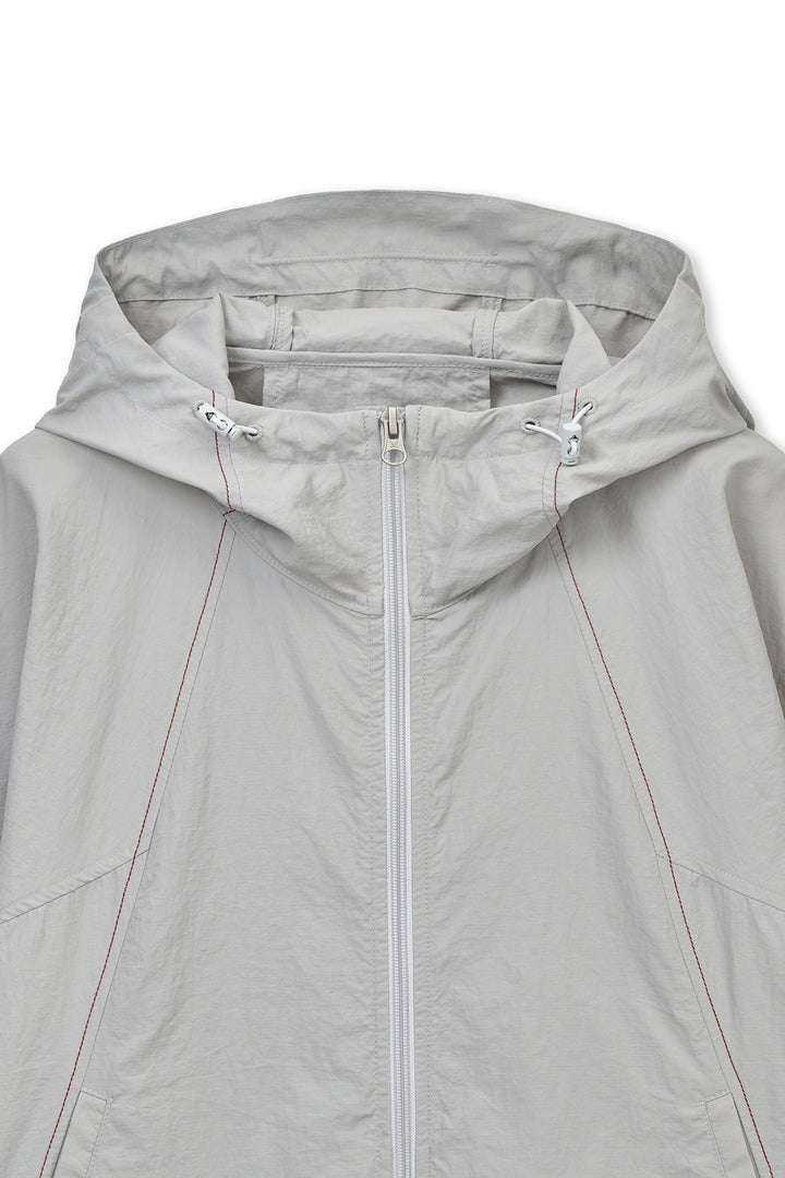 Matin Kim Cropped Back Logo Windbreaker — Beige