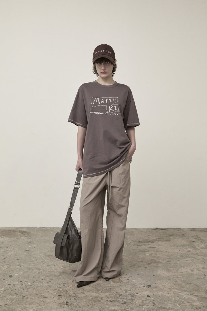 Matin Kim Side Logo Wide Track Pants — Khaki