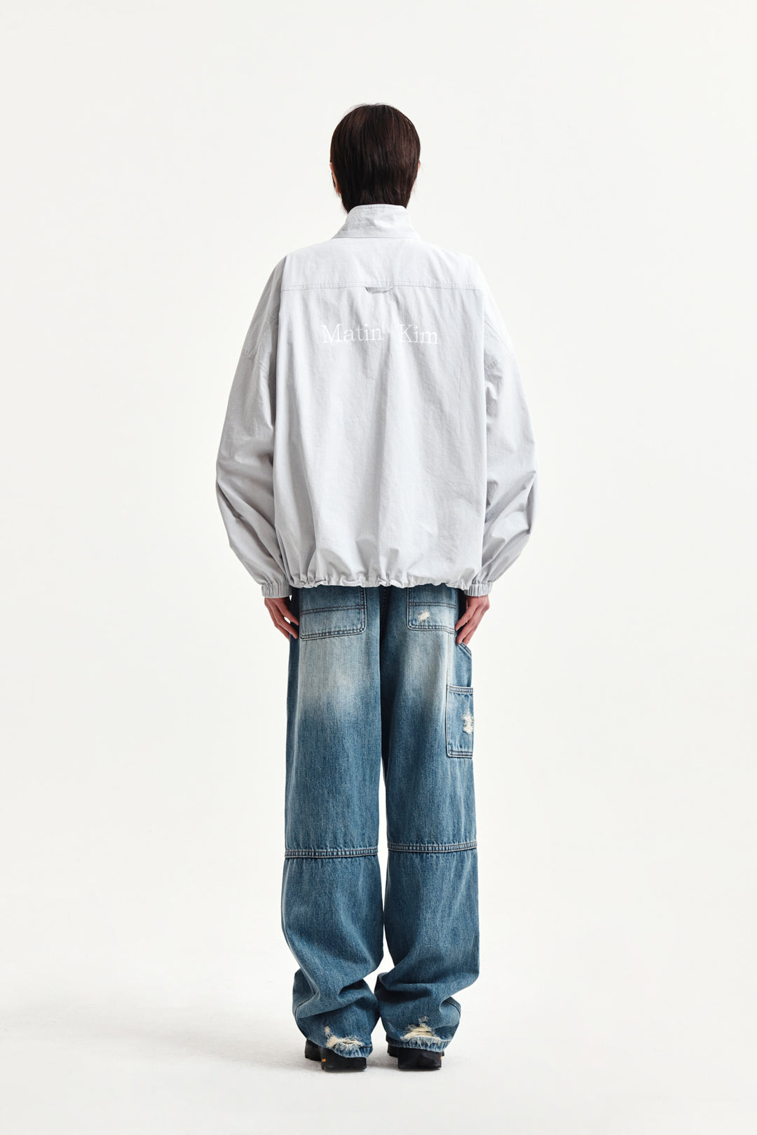 Matin Kim Back Logo High Neck Jumper — Light Grey