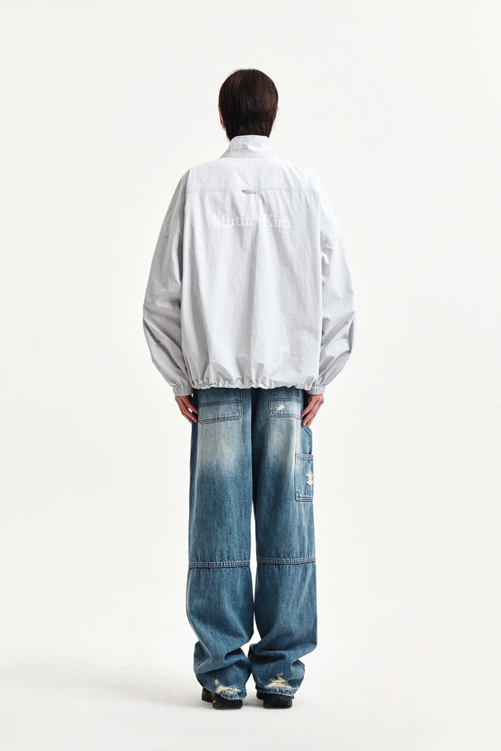 Matin Kim Back Logo High Neck Jumper — Light Grey