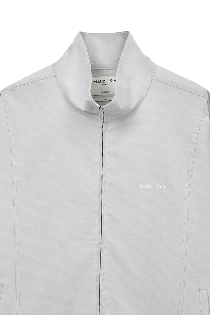 Matin Kim Back Logo High Neck Jumper — Light Grey