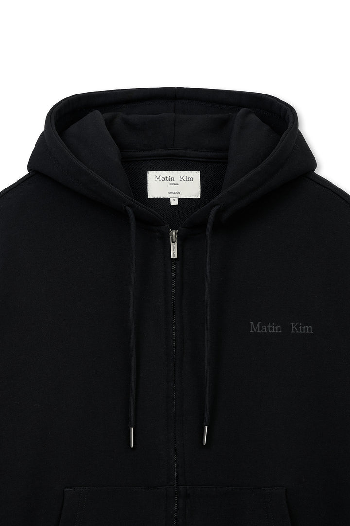 Matin Kim Back Logo Essential Zip Hoodie — Black