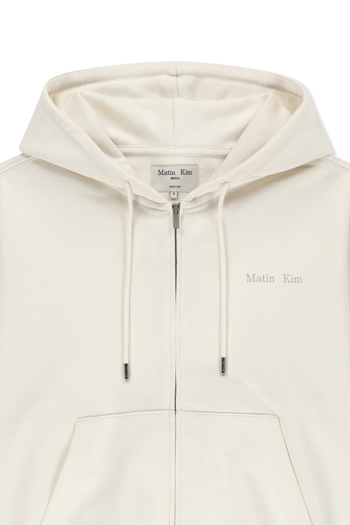 Matin Kim Back Logo Essential Zip Hoodie — Ivory