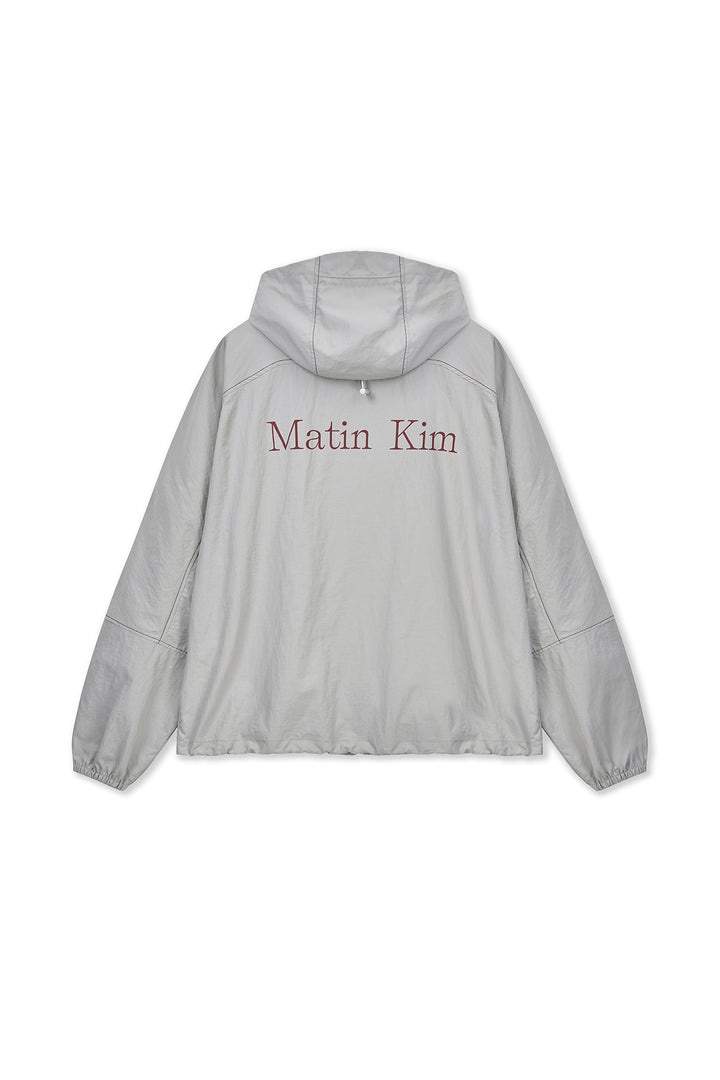 Matin Kim Back Logo Windbreaker — Light — Beige