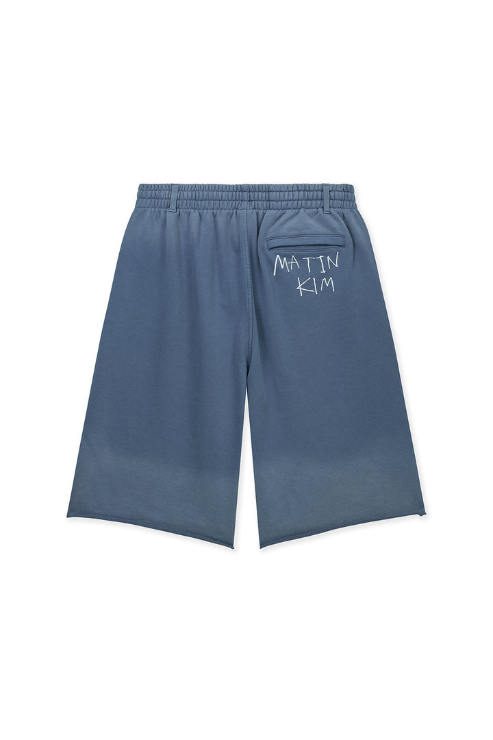 Matin Kim Vintage Washed Back Logo Bermuda Sweatpants — Blue