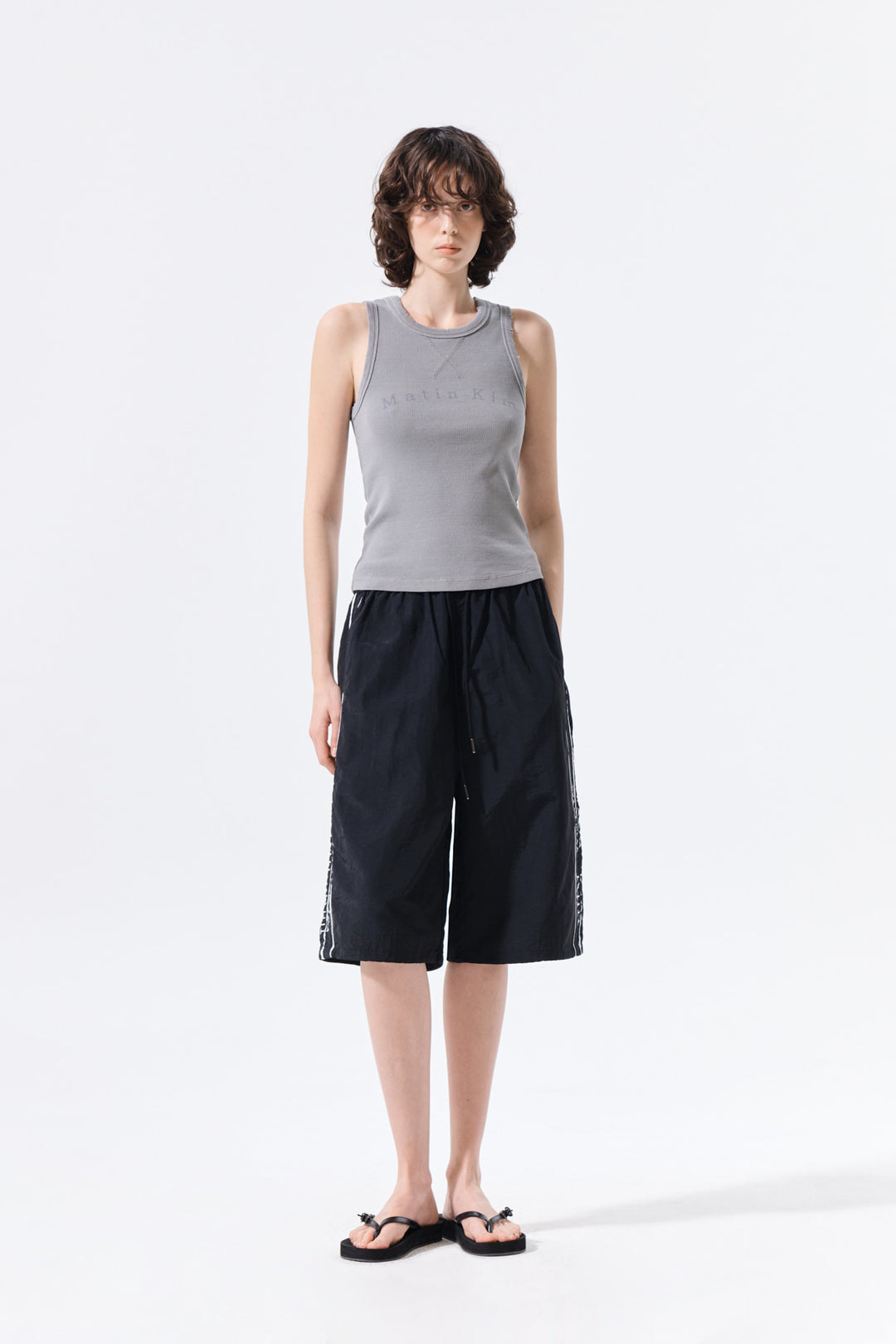 Matin Kim Side Logo Bermuda Track Pants — Black