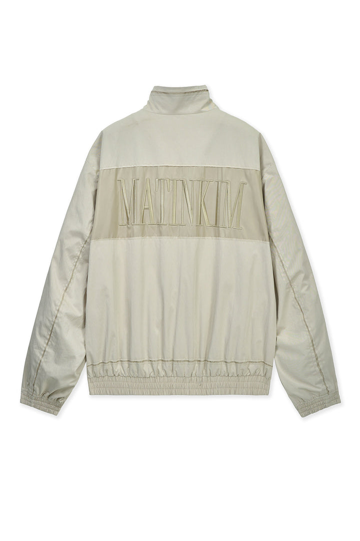 Matin Kim Embroidery Back Logo Jumper — Beige