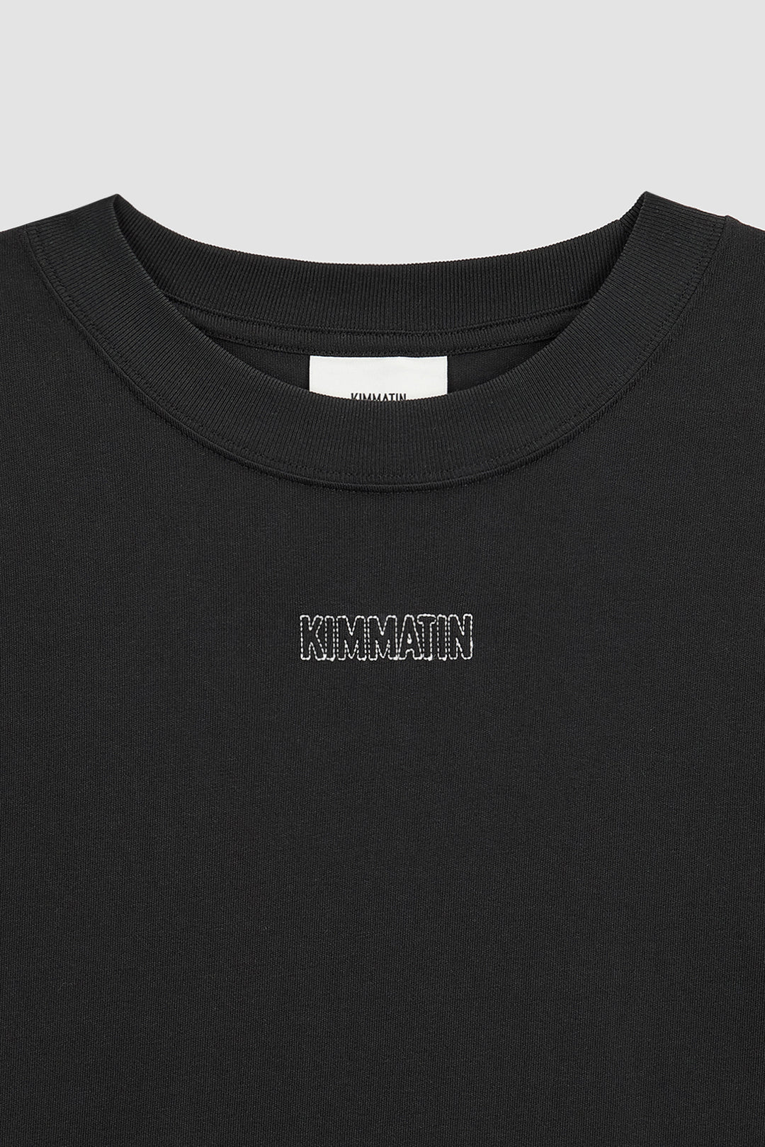 KIMMATIN Logo Embroidery Oversize Top — Black