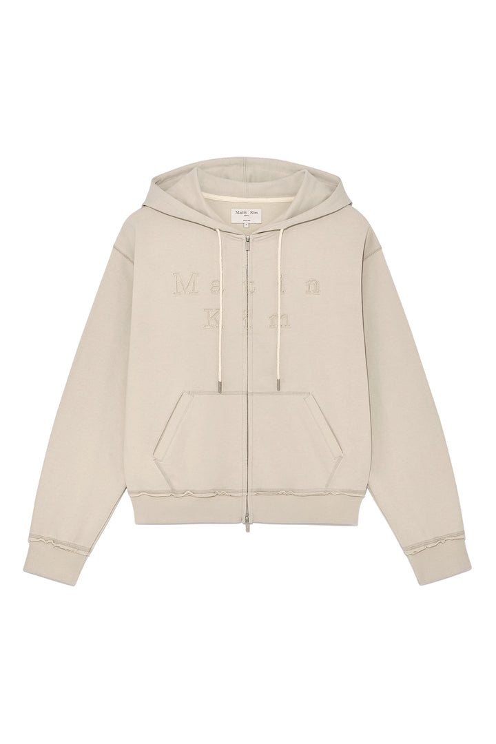 Matin Kim Appliqué Cutout Logo Zip Hoodie — Beige