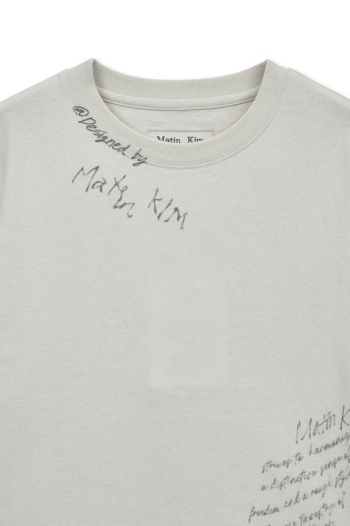 Matin Kim Graffiti Round Hem Crop Top — Cream