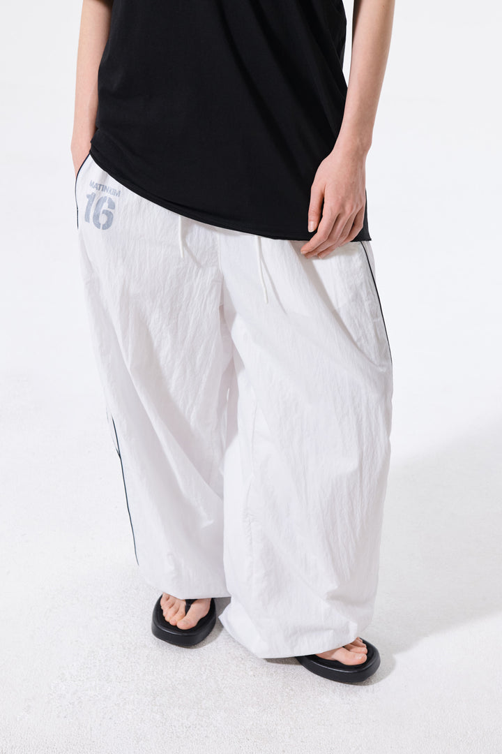 Matin Kim 16 Logo Track Pants — White