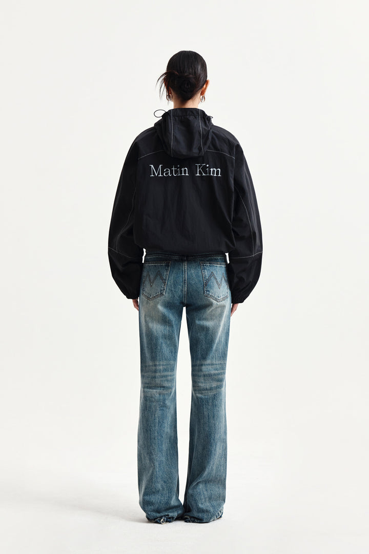 Matin Kim Cropped Back Logo Windbreaker — Black