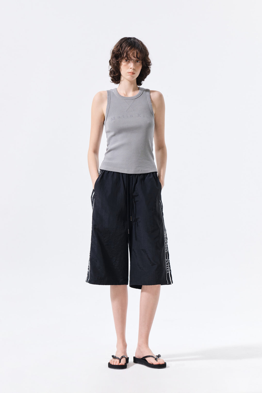 Matin Kim Side Logo Bermuda Track Pants — Black