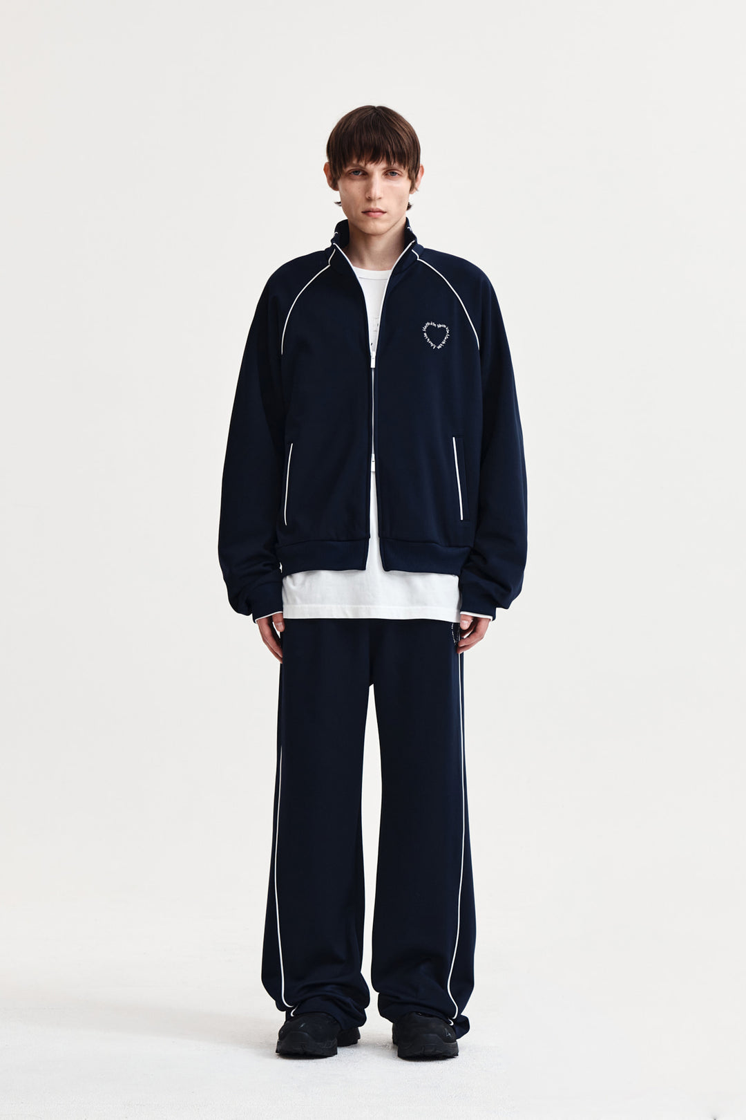 Matin Kim Heart Logo Track Pants — Navy blue