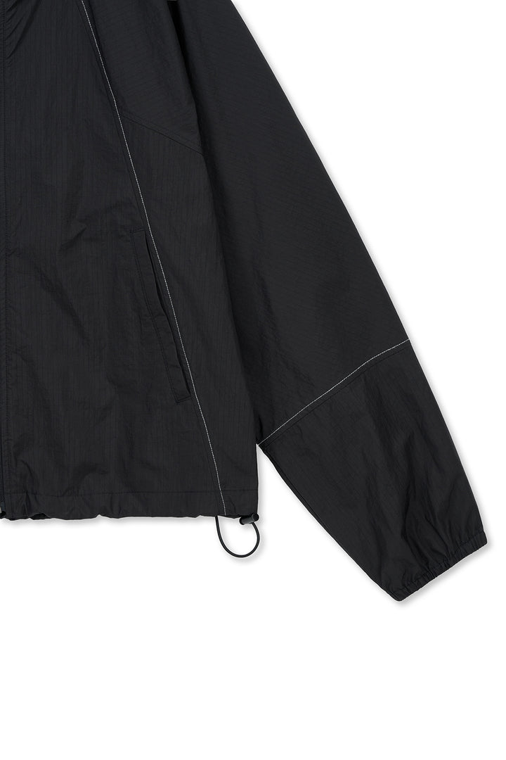 Matin Kim Cropped Back Logo Windbreaker — Black