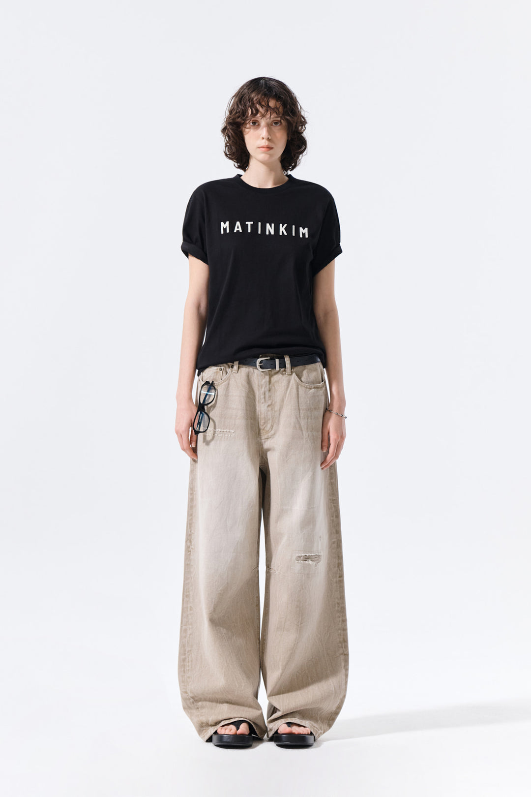 Matin Kim Back Logo Washed Denim Pants — Beige