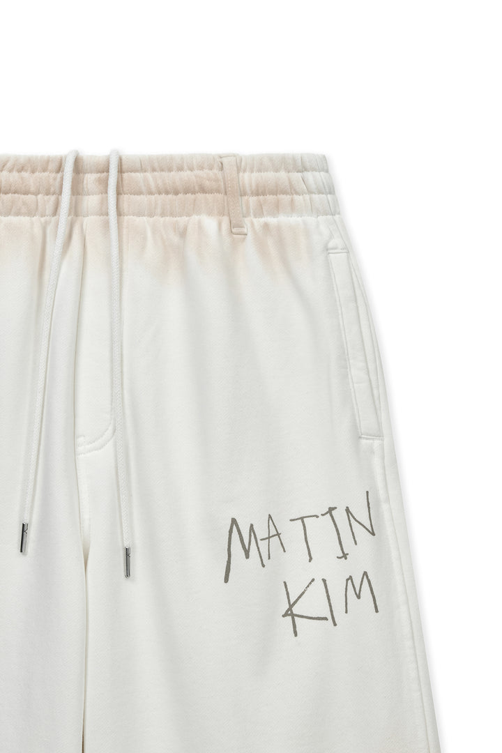 Matin Kim Vintage Washed Logo Sweatpants — Ivory